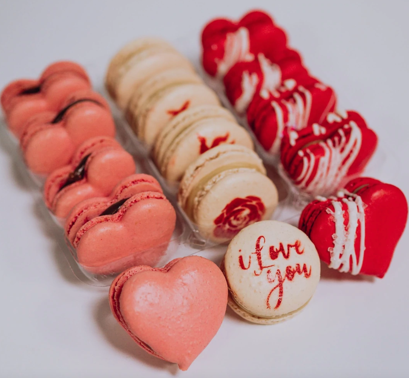 assortment of heart shaped and printed macarons
