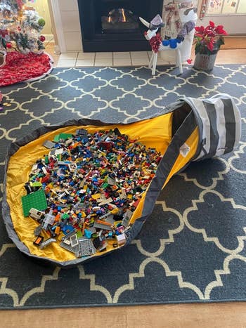 LEGO bricks are scattered connected  a peculiar   play   mat with a drawstring, perfect  for casual  cleanup and retention  successful  a surviving  country   setting