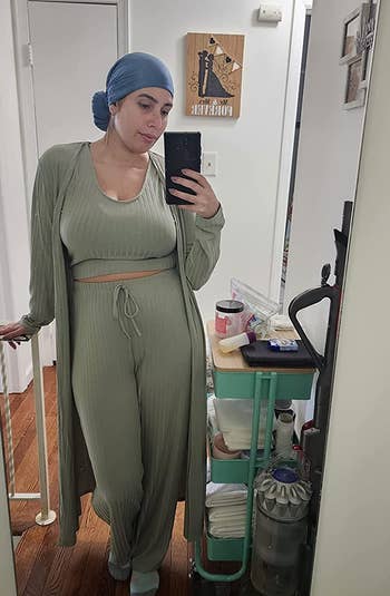 a reviewer wearing the ribbed tank, pants, and cardigan in light green 