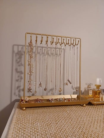 reviewer photo of necklace stand on counter