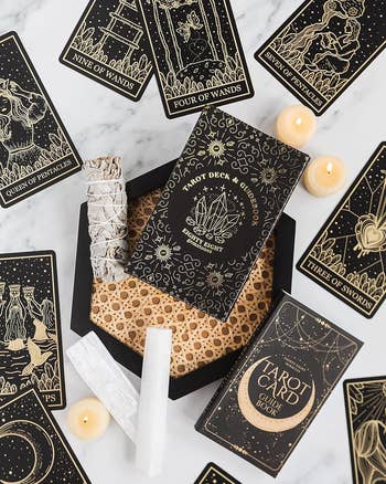 Black tarot cards with gold vintage detailing 
