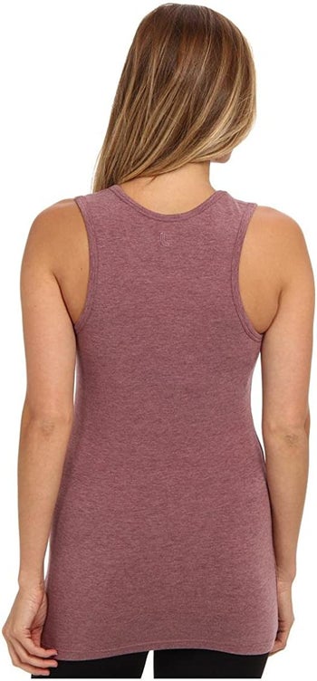 the back view of a model wearing a racerback shirt with no bra straps showing 