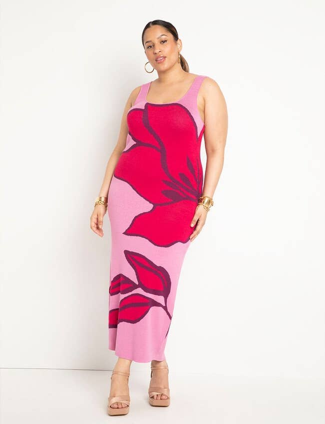 model in sleeveless intarsia sweater-style dress with pink botanical design