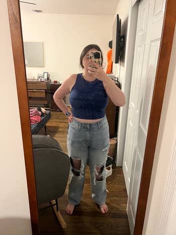 buzzfeed editor wearing the blue top with baggy ripped jeans