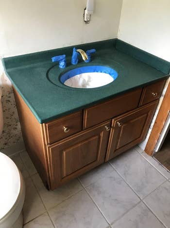 the reviewer's old green bathroom sink