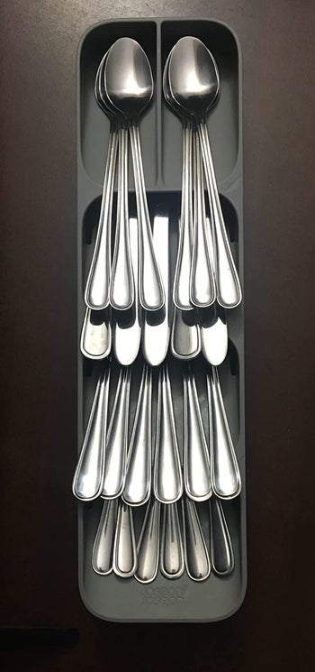 Reviewer's organizer neatly filled with silverware