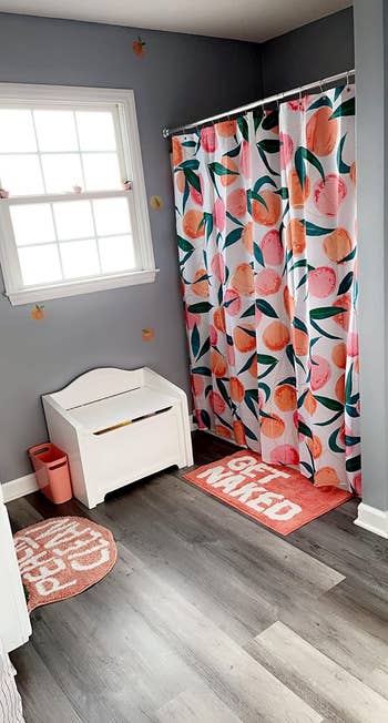 reviewer's fruit-themed shower curtain 