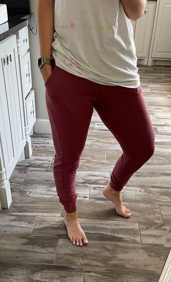 a reviewer in burgundy stretchy joggers