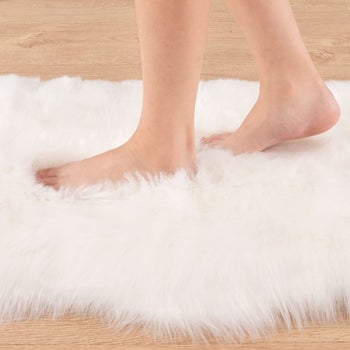Model's bare feet on the rug