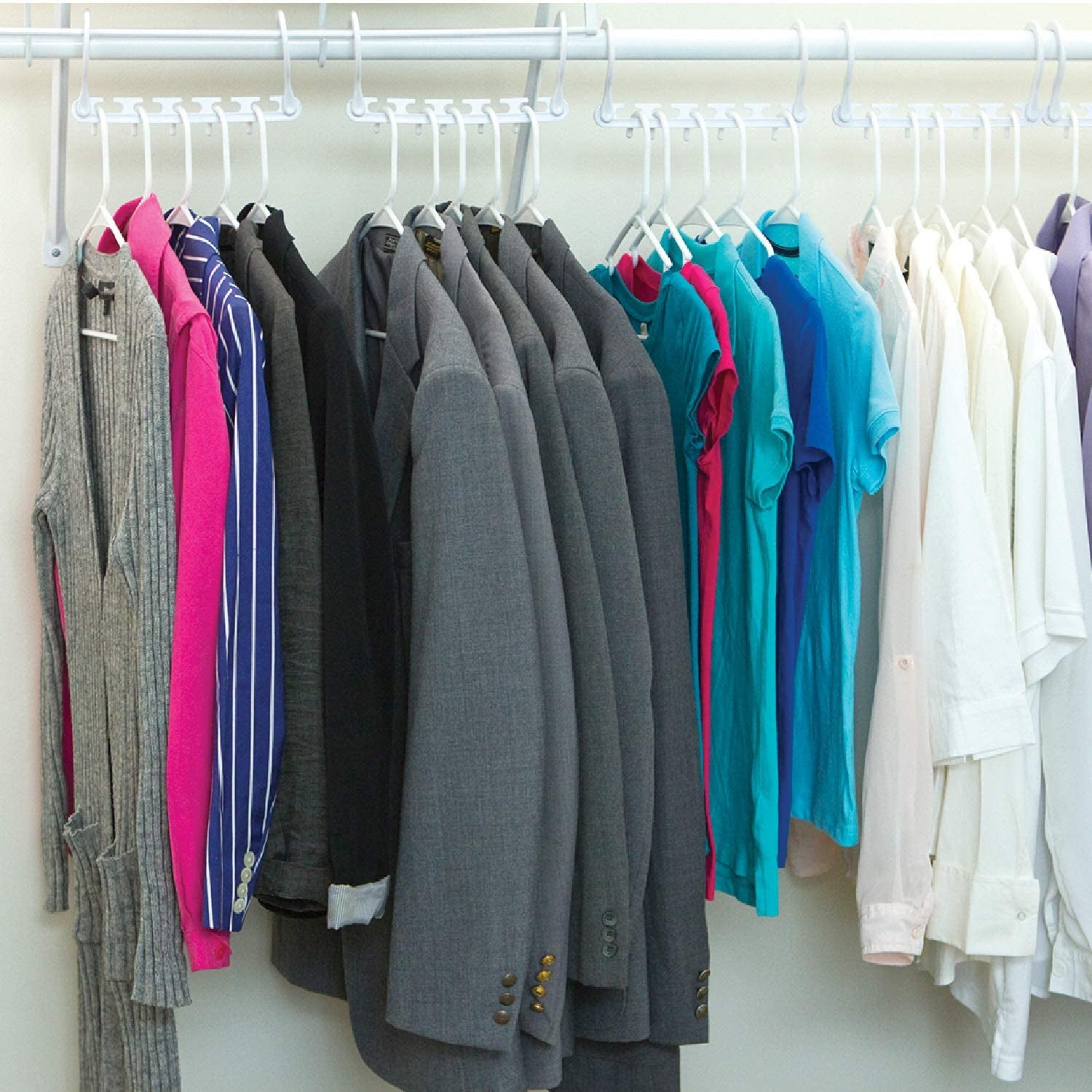 clothes hanging horizontally on wonder hangers in a closet
