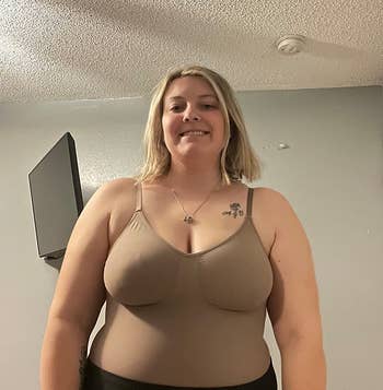 reviewer wearing the body suit