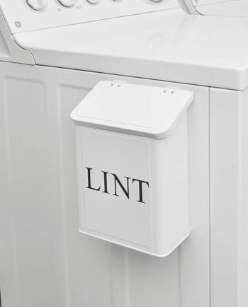 white lint bin attached to dryer