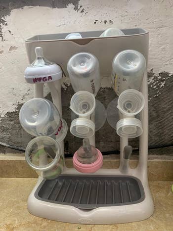 reviewer image of bottles and lids drying on the drying rack