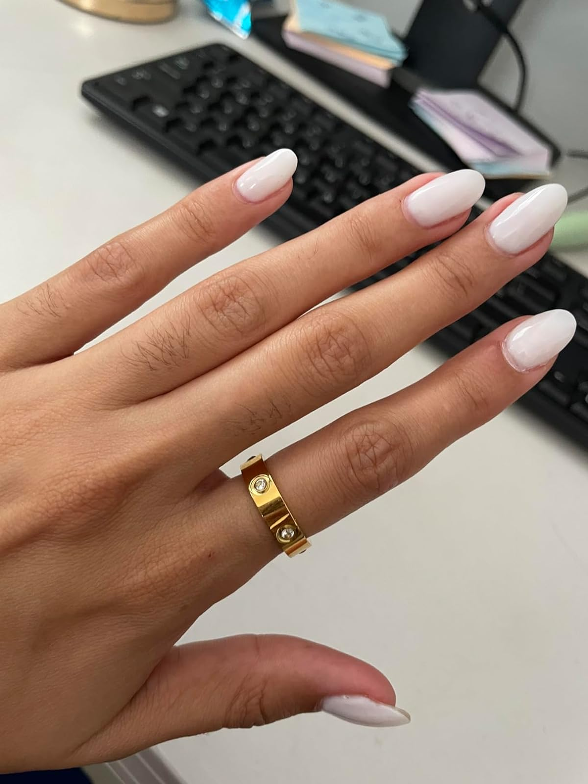 reviewer wearing the gold ring