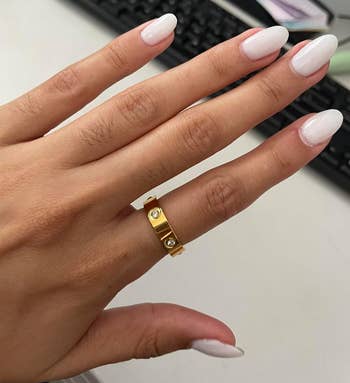 reviewer wearing the gold ring