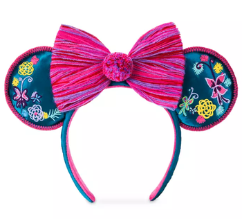 a close up on the encanto themed minnie mouse ears