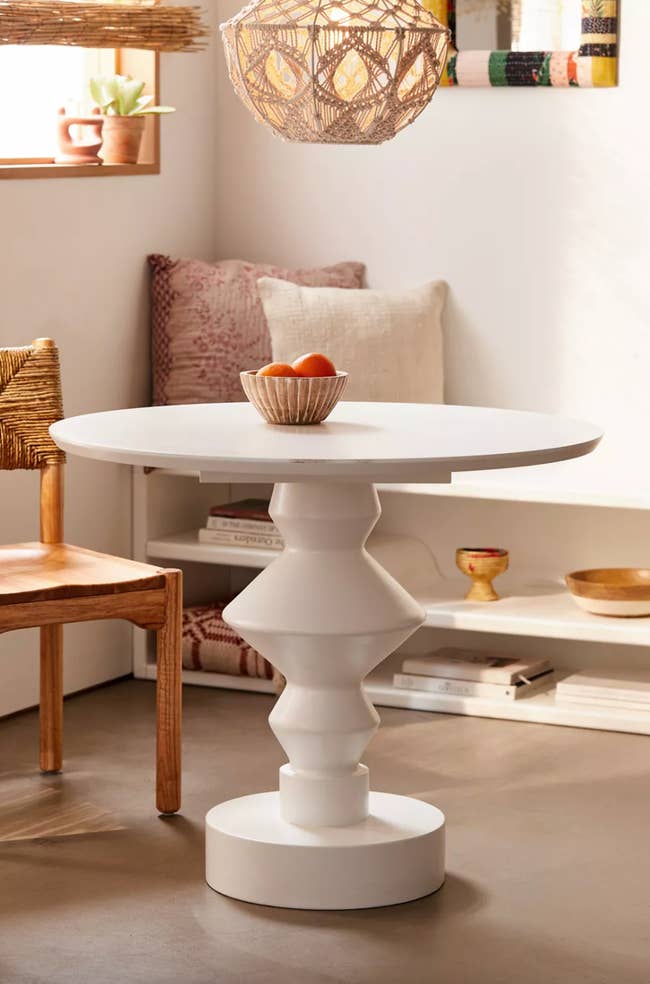 white geometric pedestal table