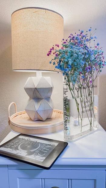 Blue and purple flowers inside the clear vase