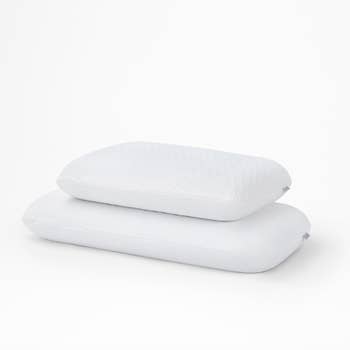 two of the foam pillows stacked on top of each other with the bottom one larger than the top