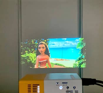 reviewer's mini projector casting an image on the wall