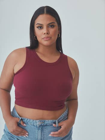model posing wearing wine colored tank top