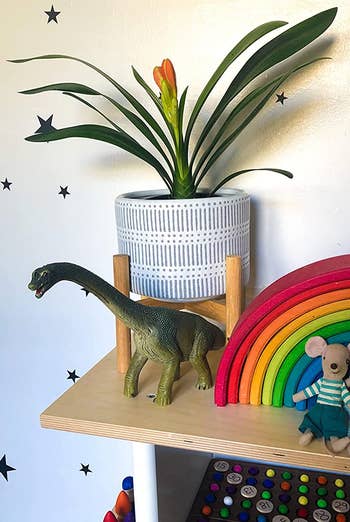 the same planter arranged in a kids room
