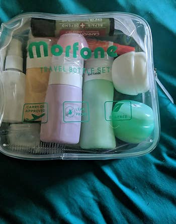 Reviewer photo of travel bottles inside of the clear travel bag