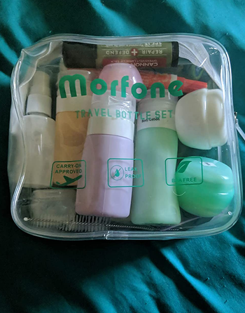 Reviewer photo of travel bottles inside of the clear travel bag