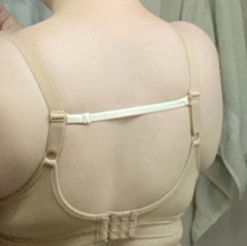 reviewer wearing razor bra strap clips on bra
