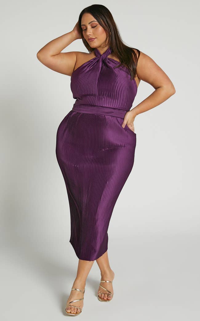 model wearing the pleated halter dress in purple