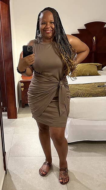 different reviewer wearing the dress in brown