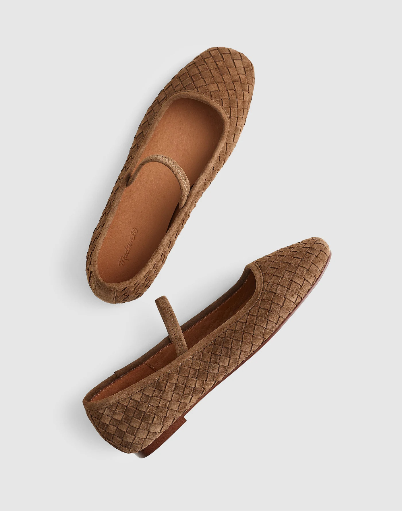 Woven brown slip-on ballet flats with a textured design and a subtle strap across the top