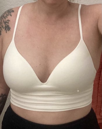 reviewer photo of them wearing the white bralette