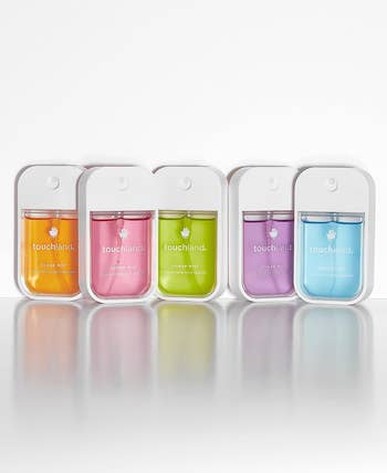 five small touchland hand sanitizer sprays