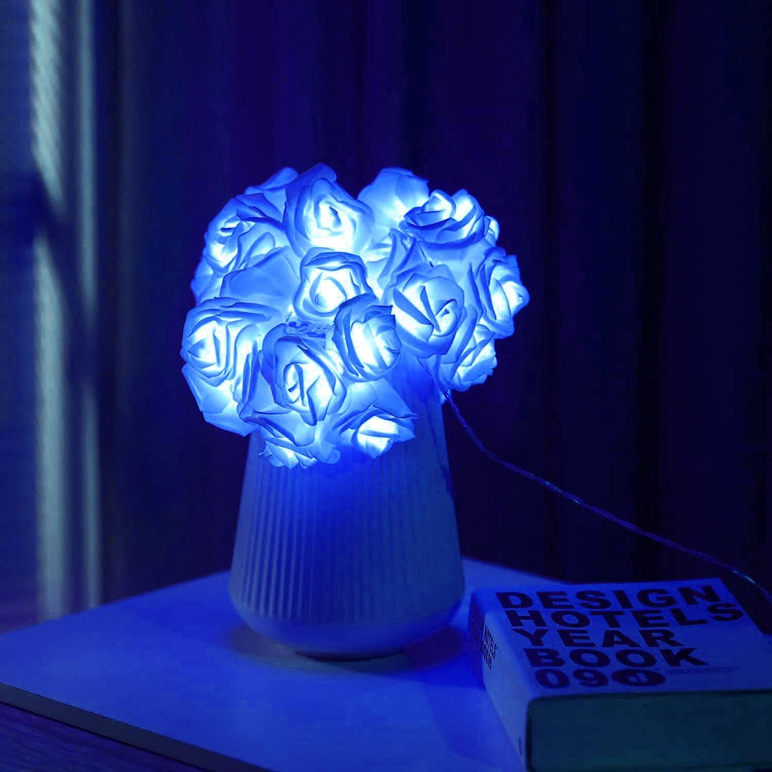 vase with blue light up rose lights gathered in it