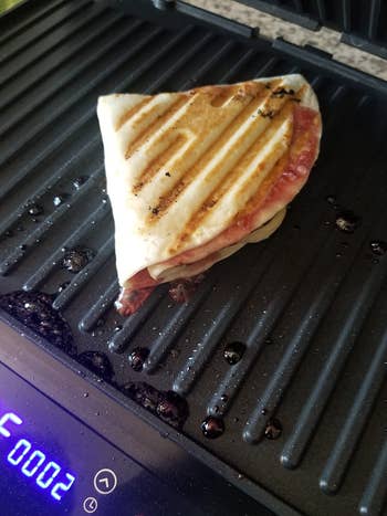 Reviewer image of sandwich on grill