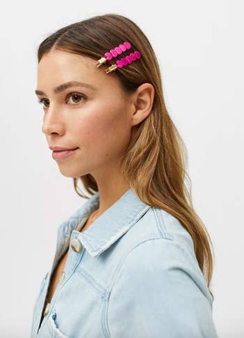 model wearing two heart alligator clips on side of hair