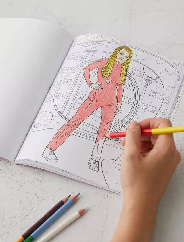 person coloring in an illustration of Britney Spears