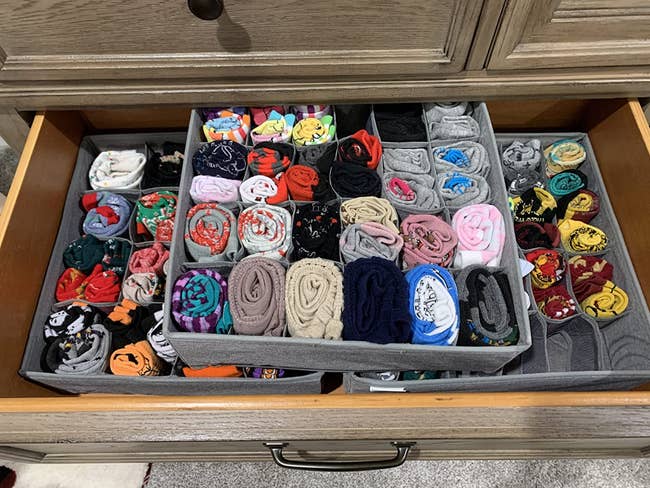 The drawer organizers full of neat and tidy socks