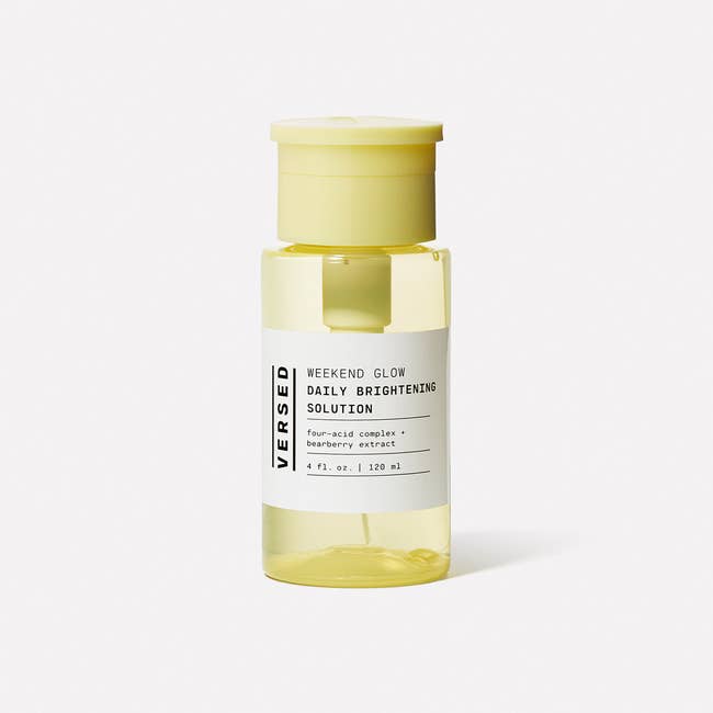 a yellow bottle of versed weekend glow daily brightening solution