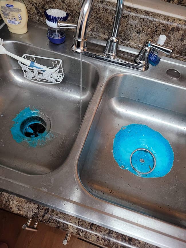 reviewer pic of two-sided silver sink with foaming cleanser finished on one side and foaming cleanser cleaning out garbage disposal on right side