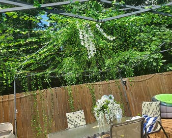 reviewer's garland arranged above an outdoor patio table
