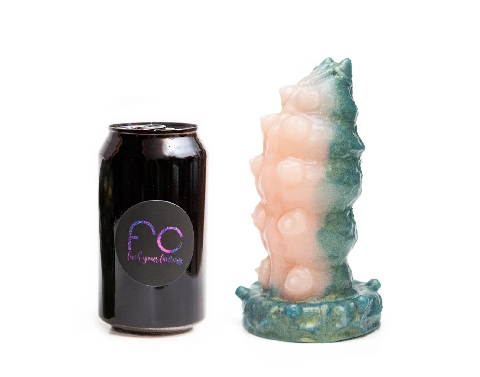 Sex toy next to soda can to demonstrate size