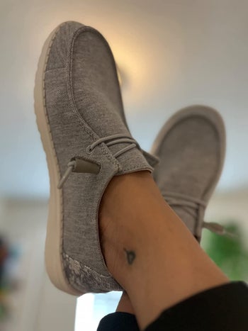 reviewer wearing the shoes in grey