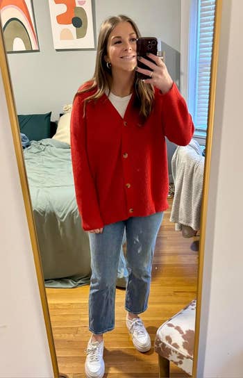 Reviewer wearing a red cardigan