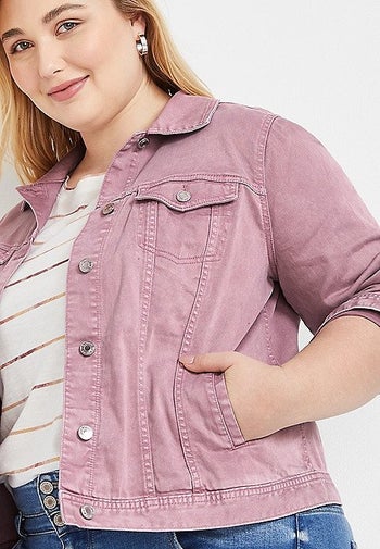 a model wearing the same jacket with a close-up of their hand in a side slip pocket 