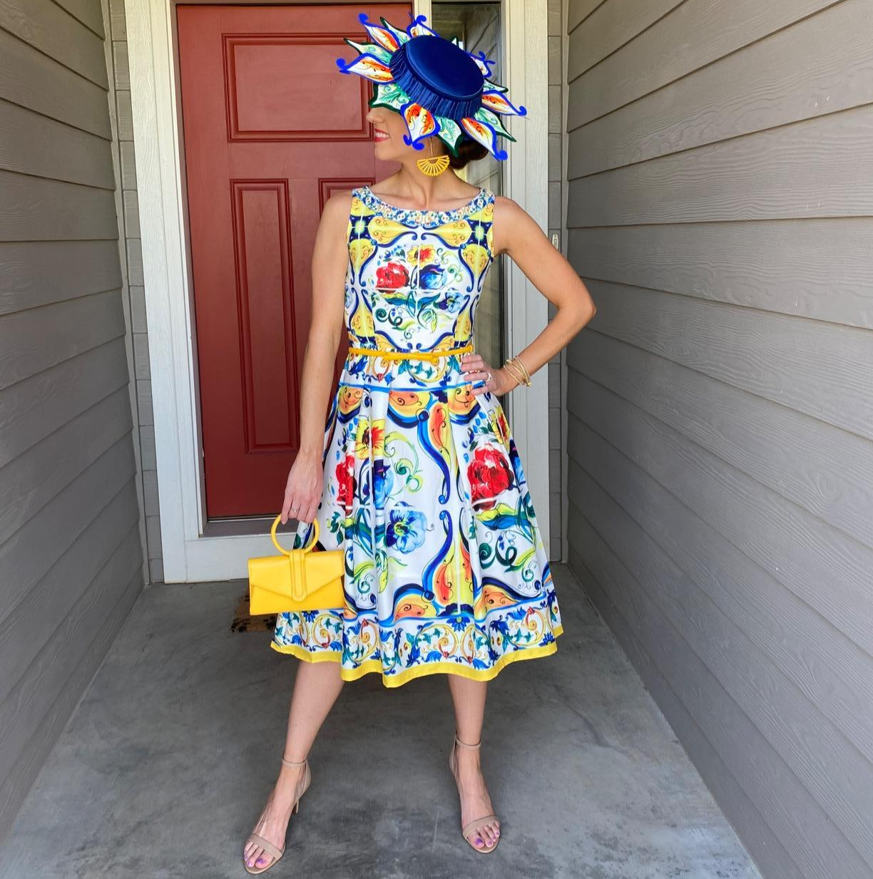 reviewer wears dress with painted flower and swirl design 