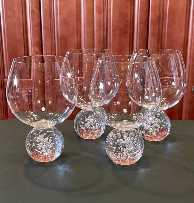 reviewer image of four of the bubble ball base wine glasses