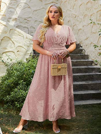 model wearing the dress in light pink
