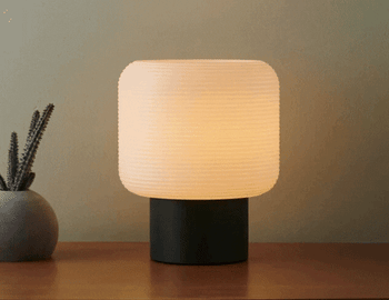 gif of a table lamp changing from daylight to nightlight 